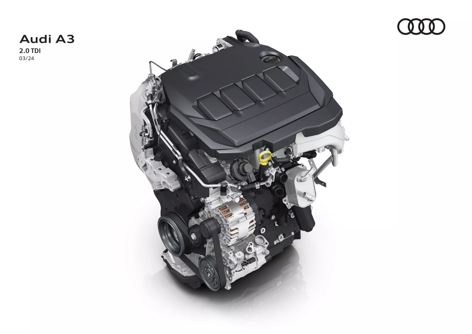 Pohled shora na motor Audi A3 2.0 TDI na bílém pozadí, zdůrazňující kryt motoru s logem Audi a klíčové technologické komponenty
