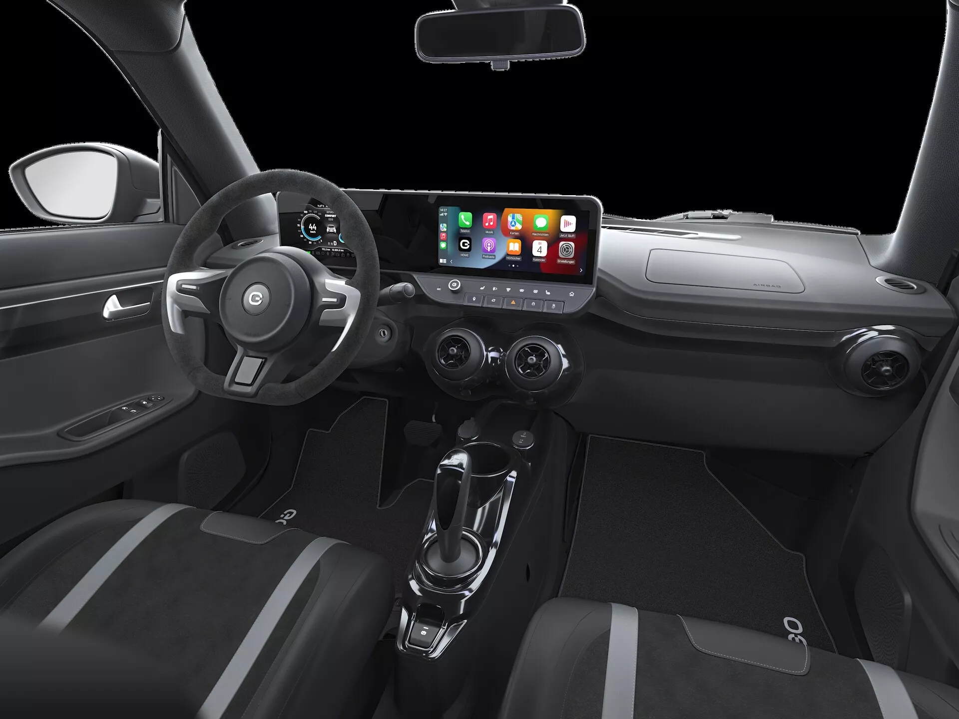 Interiér ego-mobile ewave-x 2022 první generace, zaměřený na stranu řidiče z centrální perspektivy. Vlastnosti zahrnují elegantní palubní desku s centrální obrazovkou infotainmentu se schopností integrace chytrých telefonů (pravděpodobně Apple CarPlay nebo Android Auto), tři kruhové kovově zdobené vzduchové výdechy, trojramenný volant s ovládacími tlačítky pro tempomat, audio a hlasové ovládání, automatickou převodovku s řadicí pákou a držáky nápojů na centrální konzole, a ovládání elektrických oken na dveřích řidiče. Moderní a minimalistický design zvýrazněný studiovým osvětlením.