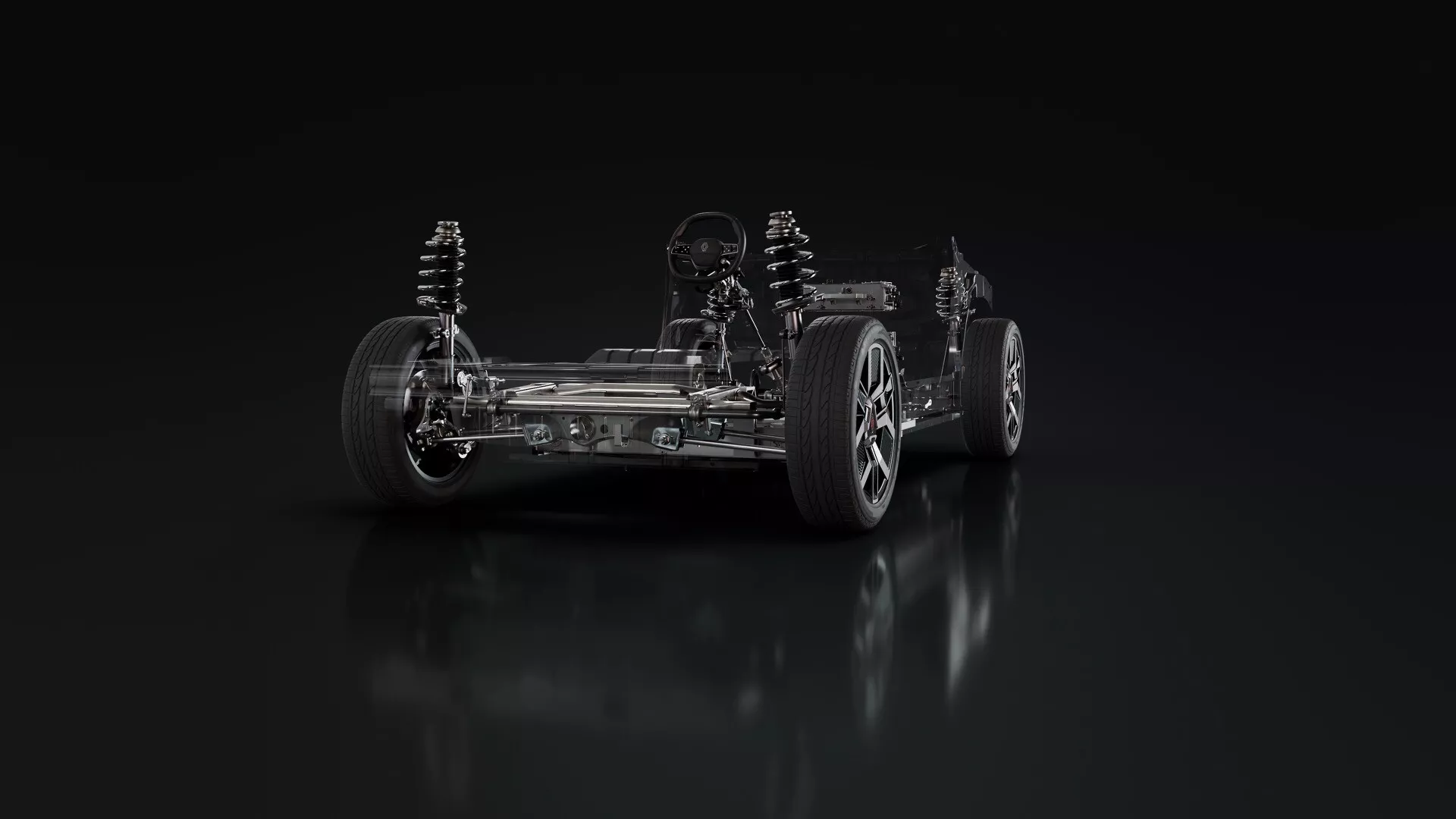 Pohled na podvozek Renaultu R5 2024 s nezávislým zavěšením kol, slitinovými koly, systémem pohonu zadních kol a detailními komponenty pohonu z nízkého úhlu tříčtvrtečního pohledu zepředu