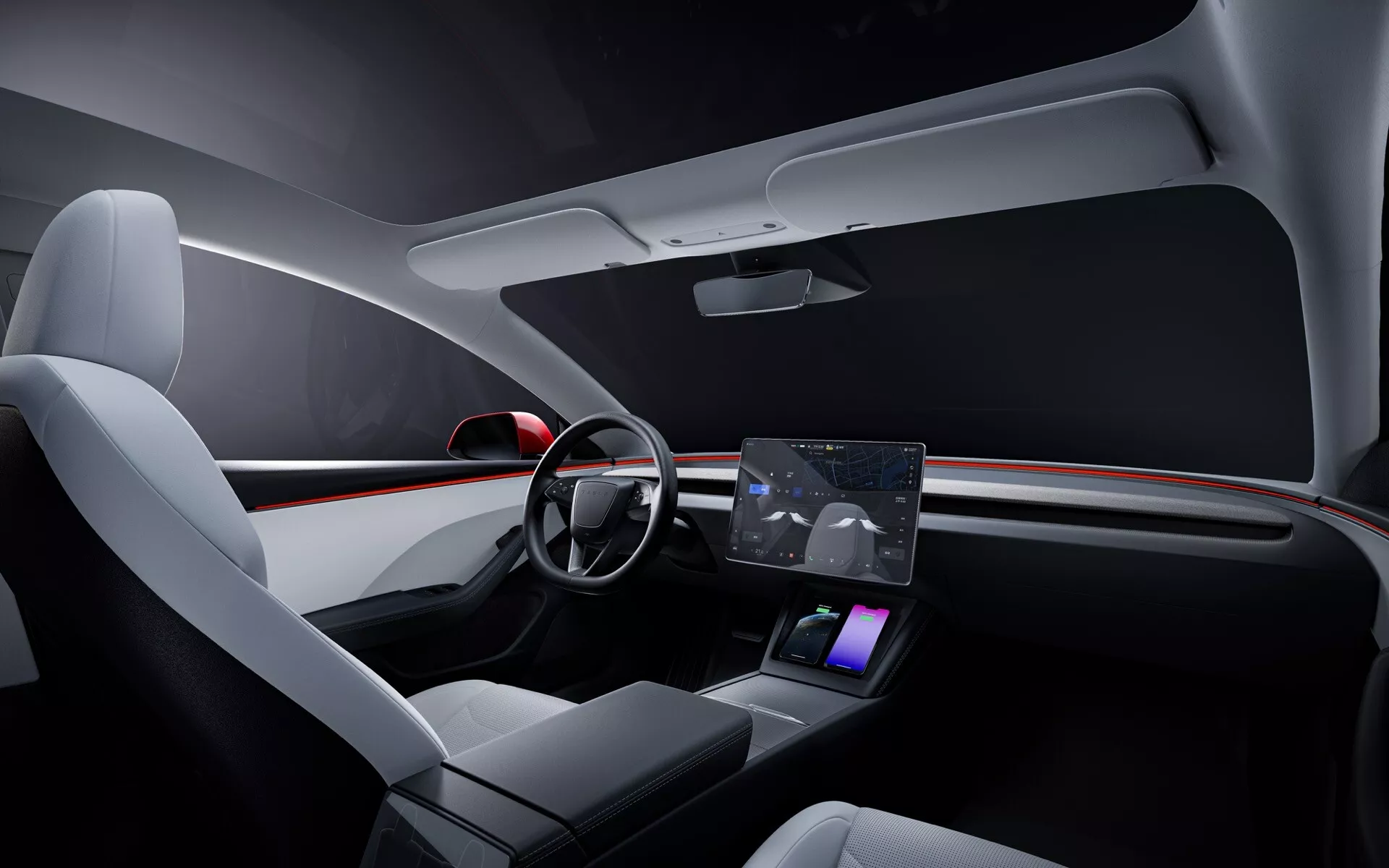 Interiér Tesly Model 3 2023 (1. generace - facelift) ukazuje přední kabinu s moderním designem palubní desky se zabudovaným prostředím s červeným akcentním osvětlením, zjednodušeným volantem se dvěma paprsky s integrovanými ovládacími prvky, výrazným centrálním dotykovým displejem pro navigaci a média, minimalistickým rozhraním pro ovládání klimatizace, přední sedadla s prémiovým čalouněním, elegantní konzolou uprostřed s bezdrátovou nabíjecí podložkou, minimalistickým panelem řidičových dveří s dotykovými ovládacími prvky a vylepšeným osvětlením interiéru pro luxusní pocit zacílený na technologie.